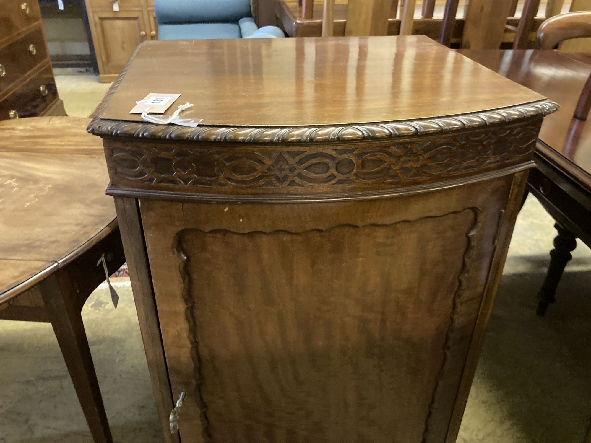 A 1920s Chippendale revival mahogany bowfront pier cabinet, width 50cm, depth 44cm, height 96cm